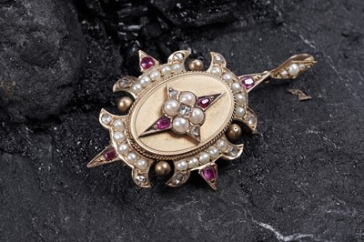 Lot 914 - A Victorian Gothic Revival ruby, pearl, and diamond pendant/brooch