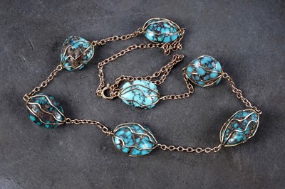 Lot 11 - A 1920's tumbled turquoise bead and 9ct rose gold necklace