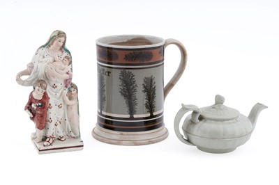 Lot 884 - A Mocha ware mug, Pearlware figure, smear-glaze teapot