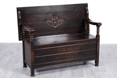 Lot 69 - An early 20th Century carved oak monk’s bench