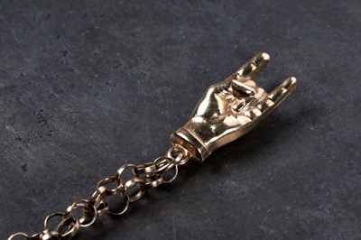 Lot 109 - A Rock and Roll "Rock On" pendant on 9ct gold chain