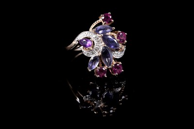 Lot 61 - A Modern pink tourmaline, iolite, amethyst and diamond cascading dress ring