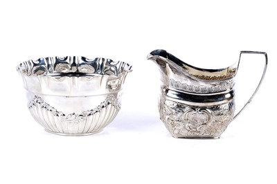 Lot 244 - A Victorian silver bonbon dish; and a George III silver cream jug; and