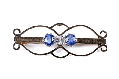 Lot 5 - An Edwardian Art Nouveau blue and white sapphire bar brooch