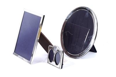 Lot 211 - Three Elizabeth II silver photograph frames