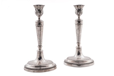 Lot 44 - A pair of antique silver candlesticks