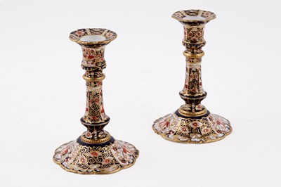 Lot 310 - A pair of Royal Crown Derby 2451 'Imari' pattern candlesticks