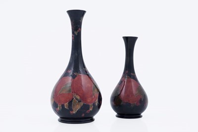 Lot 864 - Two Moorcroft Pomegranate pattern vases