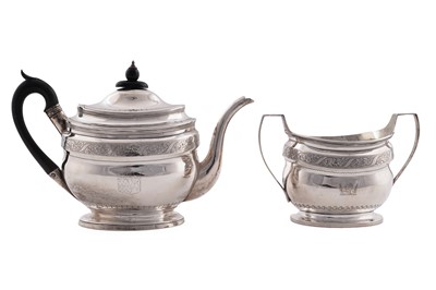 Lot 146 - A George III silver teapot; and a slightly later silver two handled sugar basin