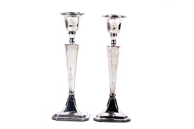 Lot 232 - A pair of George V silver candlestick holders