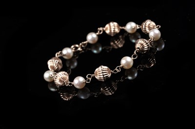 Lot 78 - A cultured pearl and 14ct rose gold bracelet