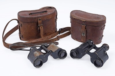 Lot 723 - Two pairs of British military issue binoculars