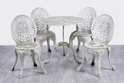 Lot 413 - A vintage white-painted cast metal garden table; and four matching chairs