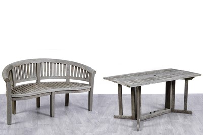 Lot 416 - A demilune teak garden bench; and a teak drop leaf garden table