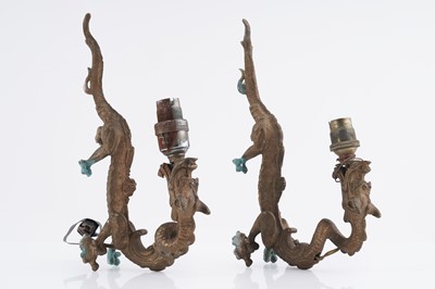 Lot 1036 - A pair of 20th Century gold painted brass dragon pattern wall lights