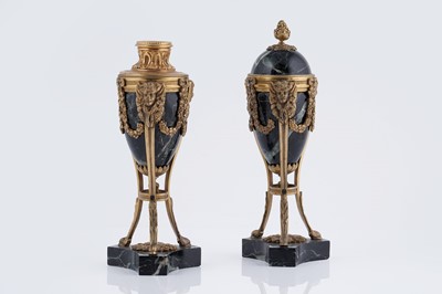 Lot 1031 - A pair of 19th Century French gilt metal and green-marble cassolettes forming candlesticks