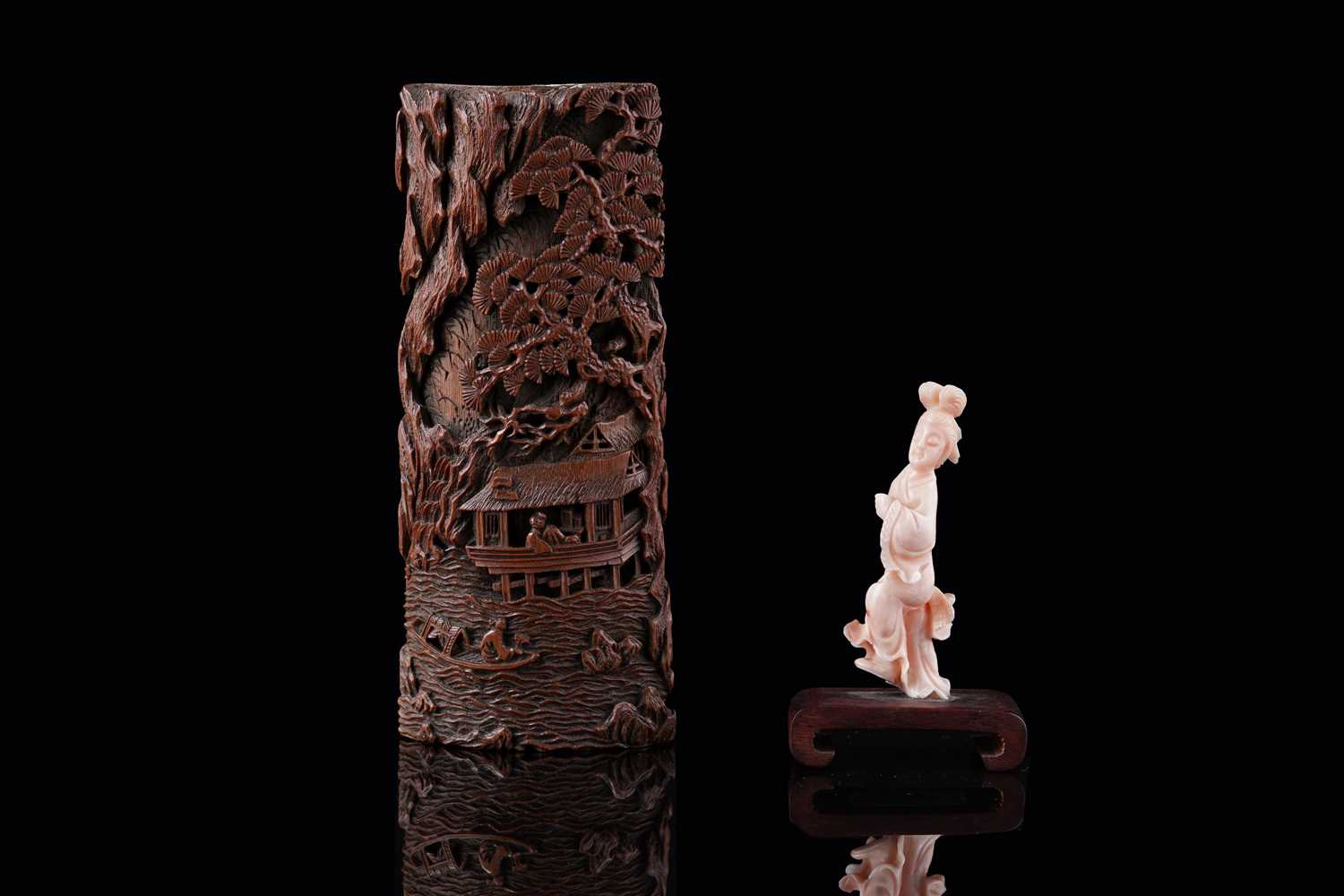 Lot 832 - A Chinese pink coral figure; and a bamboo section carving