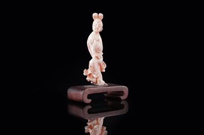 Lot 832 - A Chinese pink coral figure; and a bamboo section carving