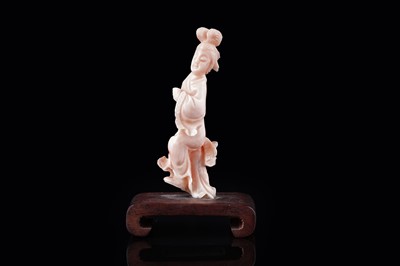 Lot 832 - A Chinese pink coral figure; and a bamboo section carving