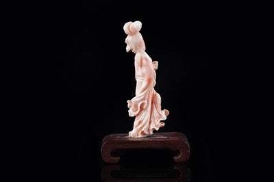 Lot 832 - A Chinese pink coral figure; and a bamboo section carving