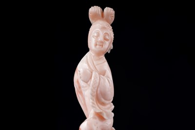Lot 832 - A Chinese pink coral figure; and a bamboo section carving
