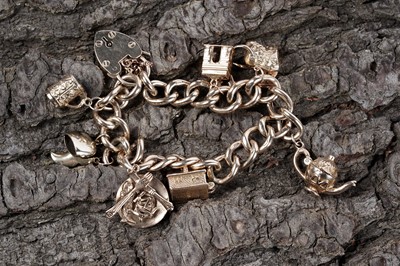 Lot 48 - A 9ct gold curb-link charm bracelet