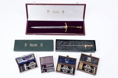 Lot 654 - Two cased commemorative Wilkinson Sword knives; with vintage razors