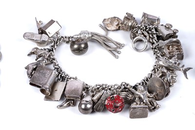 Lot 53 - Silver bracelets including: a Siamese plaque bracelet