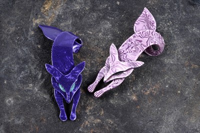 Lot 87 - Two Léa Stein celluloid fox pattern brooches