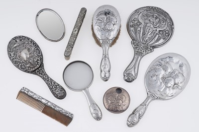 Lot 241 - Victorian and Edwardian silver hairbrushes, mirrors, a comb, and a magnifying glass