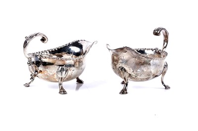 Lot 223 - A pair of George III silver sauce boats