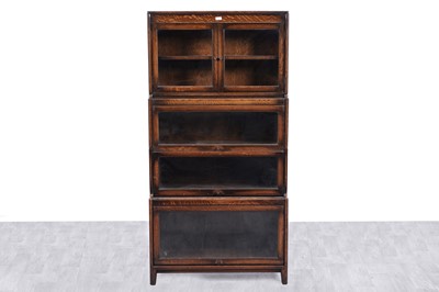 Lot 13 - Gunn: an early 20th Century oak sectional waterfall bookcase