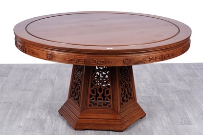 Lot 65 - A Chinese 'Ming' style hardwood dining table