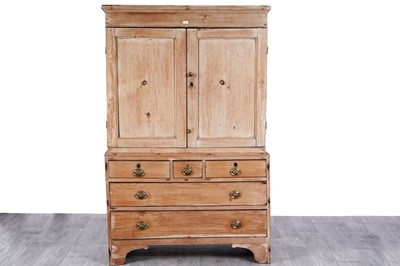 Lot 80 - A Georgian stripped pine press cupboard