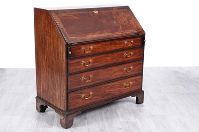 Lot 57 - A George III inlaid mahogany and walnut banded bureau