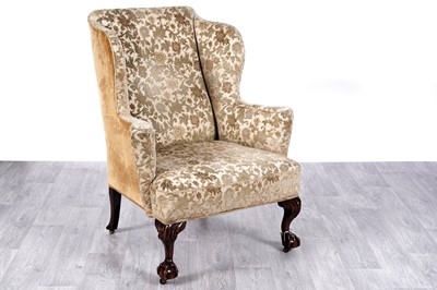 Lot 50 - A substantial 19th Century wingback armchair