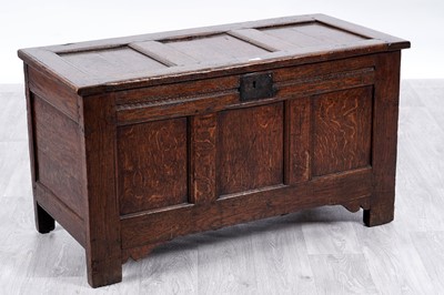Lot 16 - An oak panelled coffer with 17th Century elements