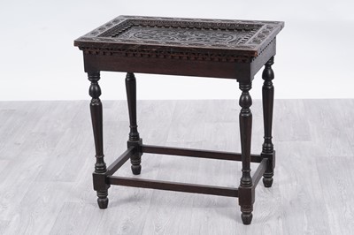 Lot 14 - A 19th Century ornate carved oak occasional table