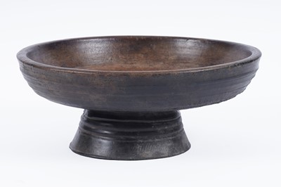 Lot 231 - A rustic turned wooden fruit bowl on stand