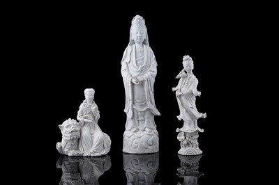 Lot 814 - Three Dehua Blanc de Chine figures of Guanyin