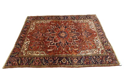 Lot 989 - A Persian hand-made Heriz carpet