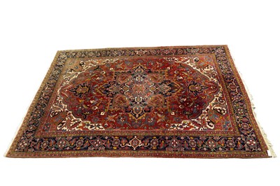 Lot 995 - A Persian hand-made Heriz carpet