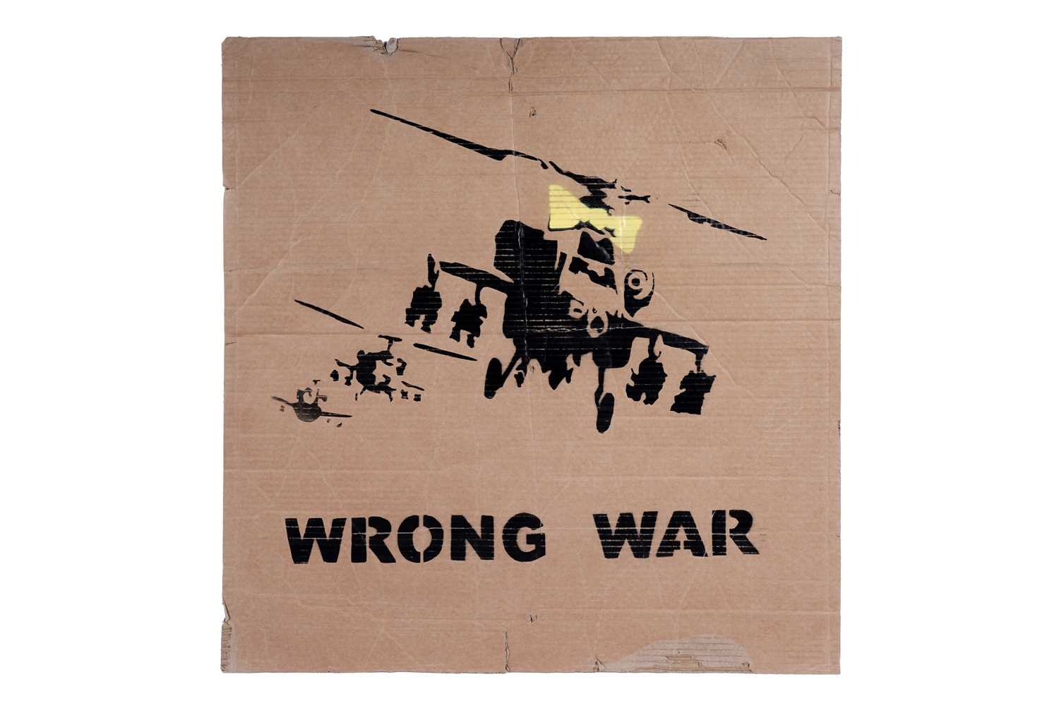 Lot 692 - BANKSY - "Happy Choppers" (Wrong War) | spray paint on cardboard