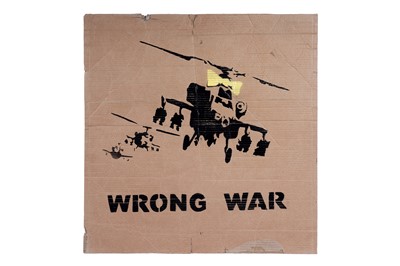 Lot 692 - BANKSY - "Happy Choppers" (Wrong War) | spray paint on cardboard