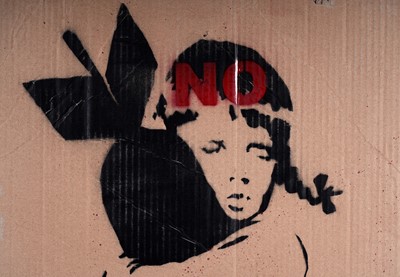 Lot 693 - BANKSY - "Bomb Hugger" | spray paint on cardboard