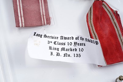 Lot 973 - A display of three German Third Reich Long Service Awards of the NSDAP