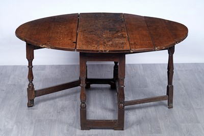 Lot 16 - An 18th Century oak drop leaf table
