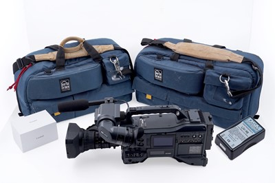Lot 751 - A Panasonic P2HD video camera; a lens; and camera bags