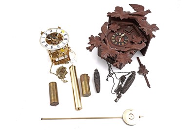Lot 197 - A Hermle brass skeleton wall clock; and a German Black Forest style cuckoo wall clock