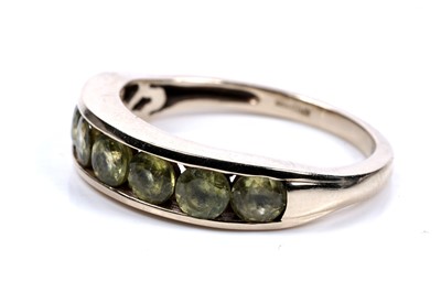 Lot 56 - A seven stone sphene ring